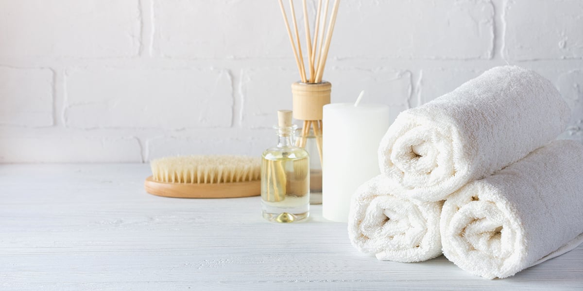 Spa treatment counter with towels and candle